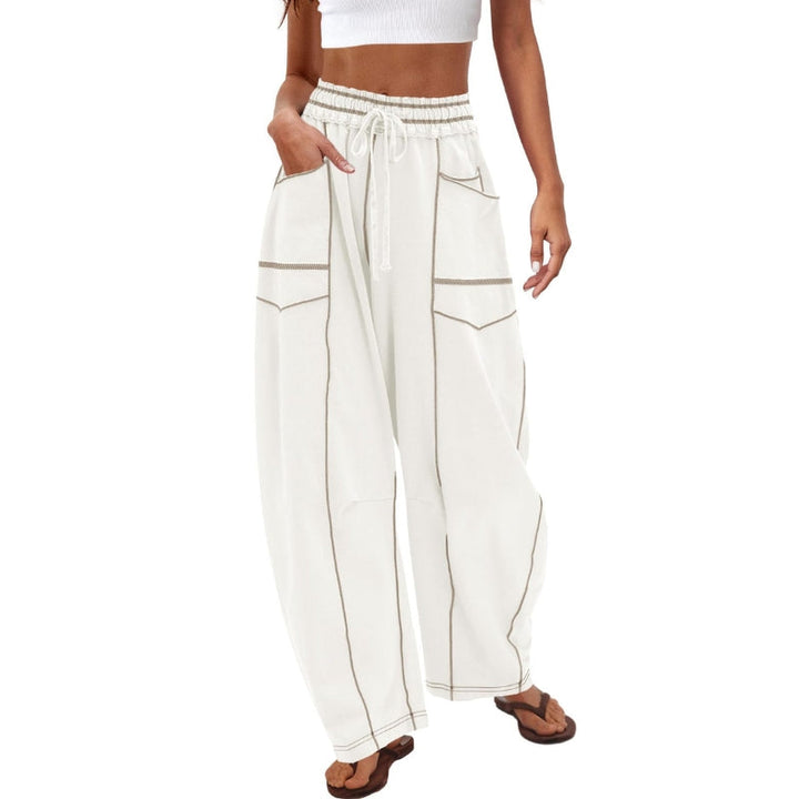 Stylish woman wearing high-rise barrel sweatpants, showcasing versatile athleisure & modern street fashion.