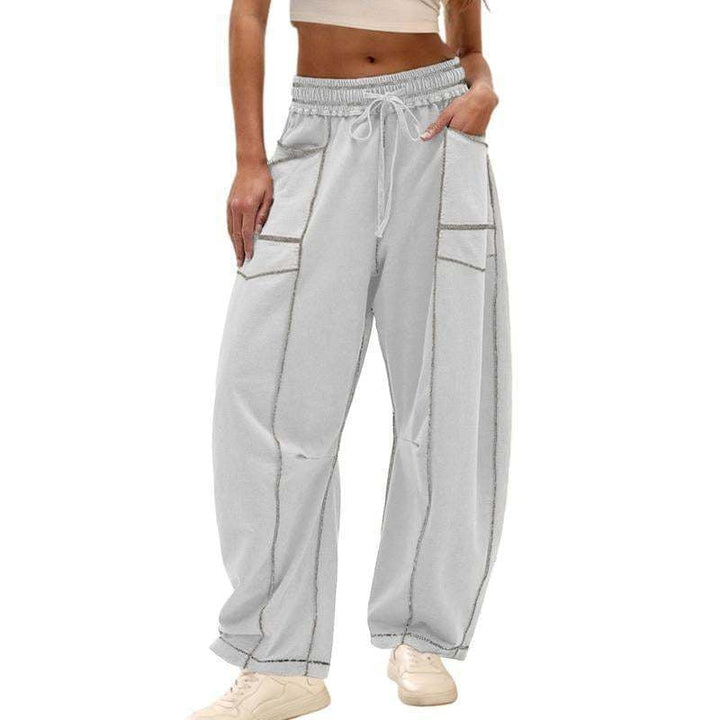 Side profile of women's barrel leg sweatpants, featuring a unique relaxed fit & high-rise design for comfort.