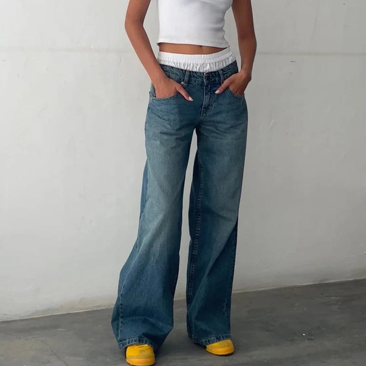 Soft, comfortable women's high-rise jeans with a flowing straight leg. Flattering fit for modern casual wear and versatile styling.