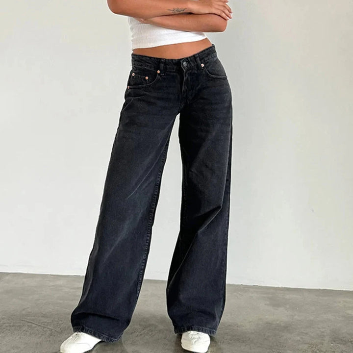 Stylish women's high-rise straight leg jeans, designed with a flowing, comfortable fit. Ideal versatile bottoms for casual wear.
