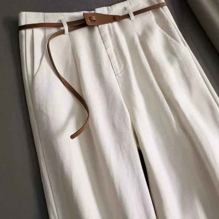 Brown high-rise flowy trousers for women, soft fabric and elegant drape for all-day comfort.