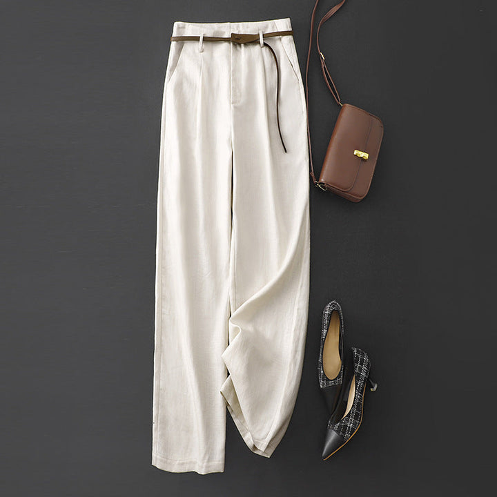 Detail of elegant high-rise flowy trousers, showcasing the soft fabric and flattering drape for women.