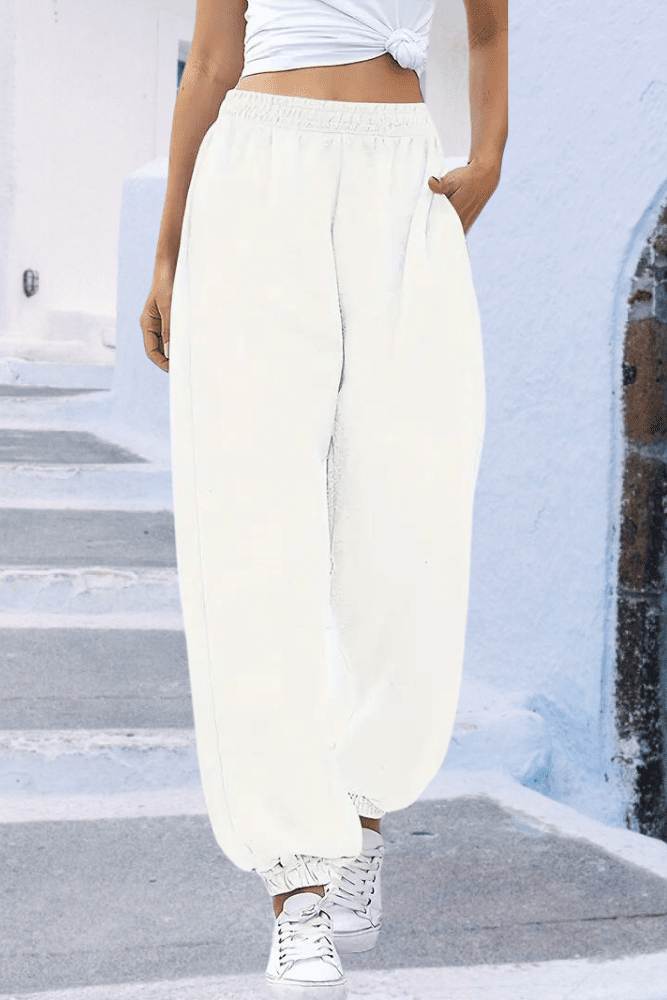 Elastic waist women's high-rise joggers, perfect cozy bottoms for relaxing or travel.