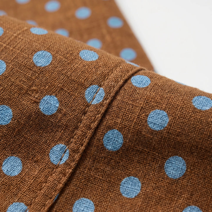 Comfortable women's polka dot wide barrel-leg pants, offering an effortless, high-rise fit for versatile styling.