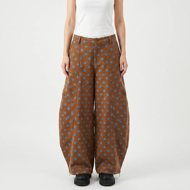 Fashionable women's polka dot barrel-leg pants, a statement piece for casual wear or summer street style.