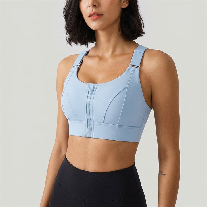 Active woman demonstrating the flexibility and quick-dry nature of the zip-front adjustable sports bra.