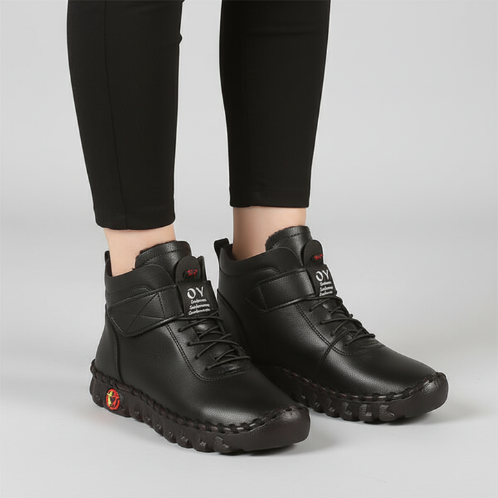 Close-up of warm lined women's high top winter boots, showcasing texture & quality stitch