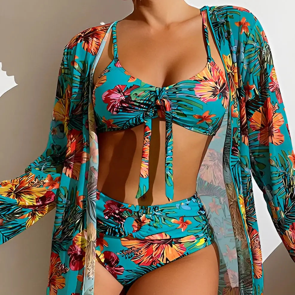 Stylish women's high-waisted floral bikini with a complementary beach cover-up.