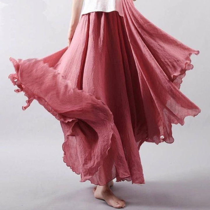 Elegant flowing bohemian maxi skirt for women, featuring a high-waist A-line cut, ideal for beach vacations.