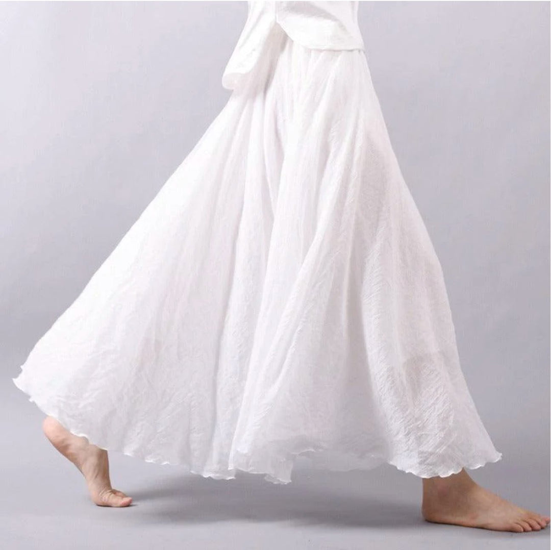 Comfortable women's flowing high-waist A-line maxi skirt, versatile bohemian summer wear for any casual occasion.