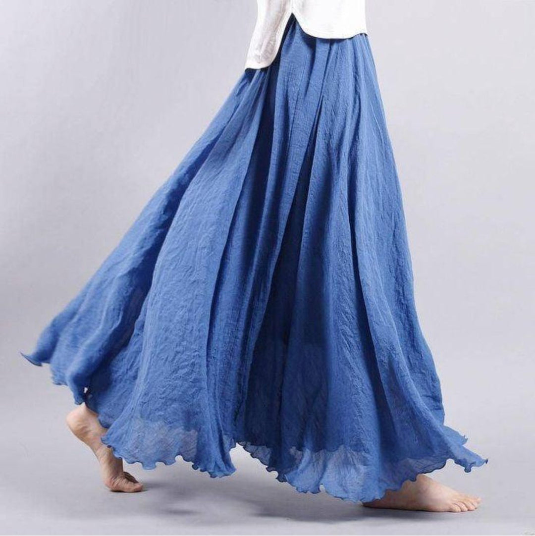 Bohemian women's high-waist A-line maxi skirt. Flowing, comfortable, and elegant for summer casual, vacation, or beach.