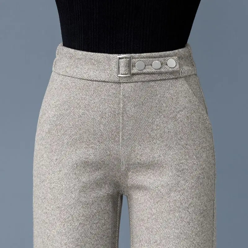 Tailored herringbone high-waist women's pants featuring elegant button detail. Perfect for formal or business attire.