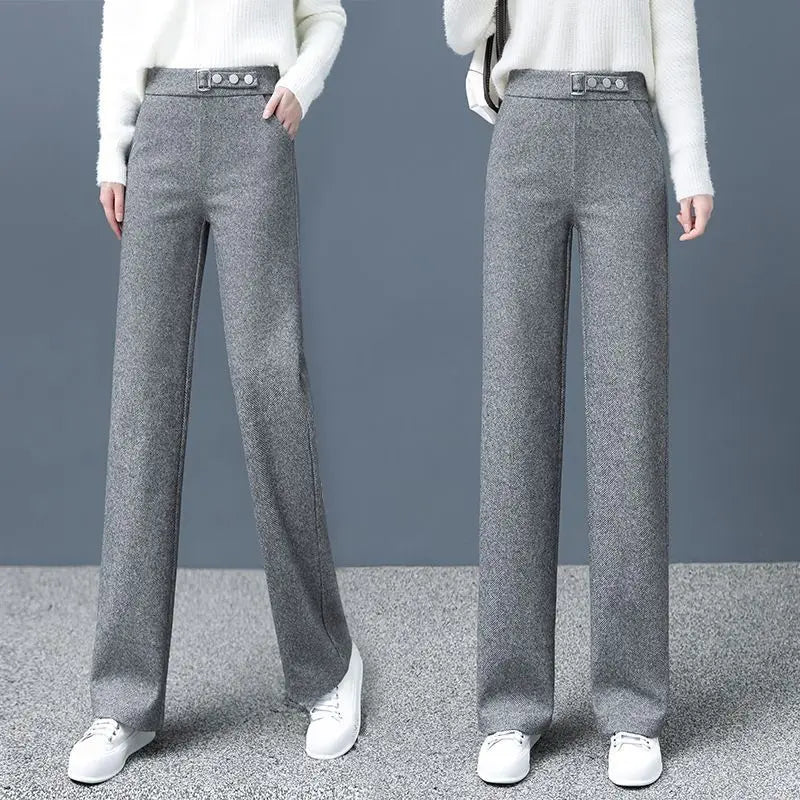 Khaki high-waist women's Astoria pants with a chic statement belt. Versatile for sophisticated office or casual style.