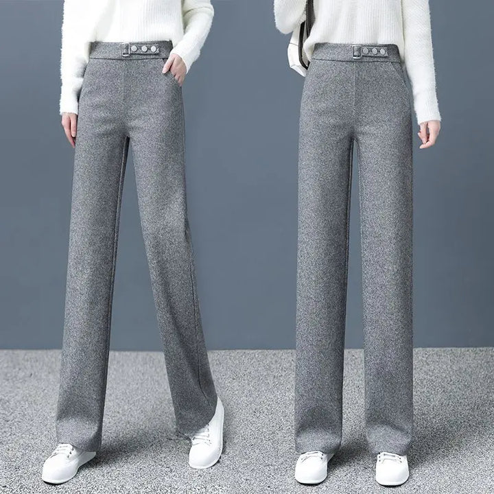 Khaki high-waist women's Astoria pants with a chic statement belt. Versatile for sophisticated office or casual style.