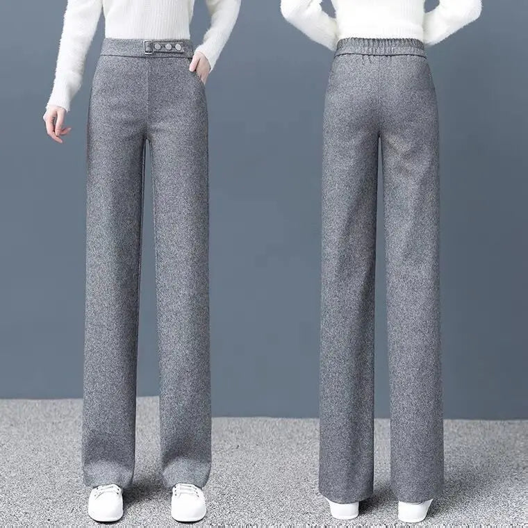 Gray tailored high-waist women's pants with stylish button detail, offering an elegant and flattering silhouette.