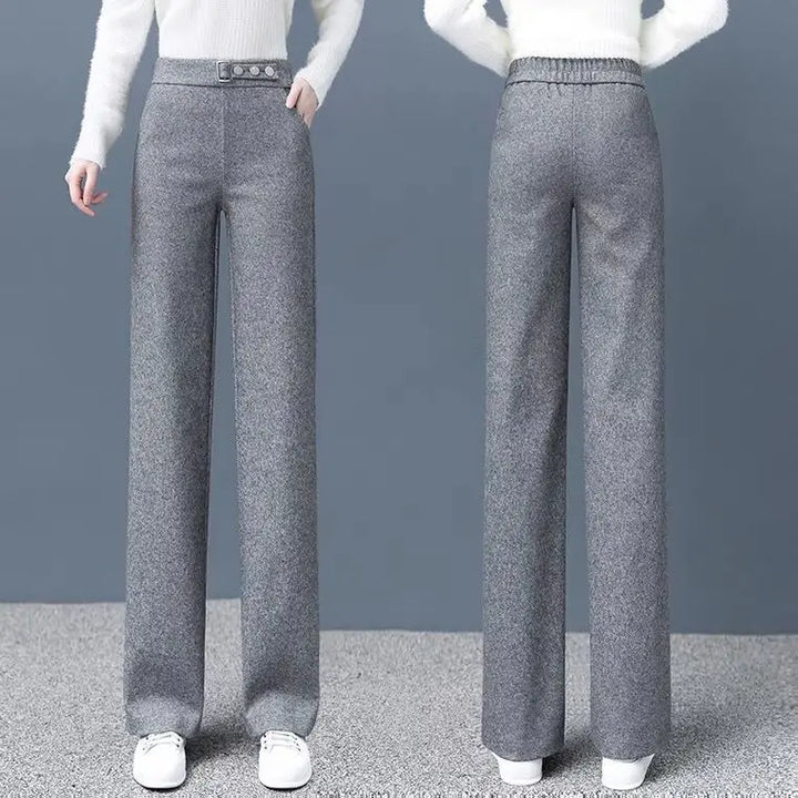 Gray tailored high-waist women's pants with stylish button detail, offering an elegant and flattering silhouette.