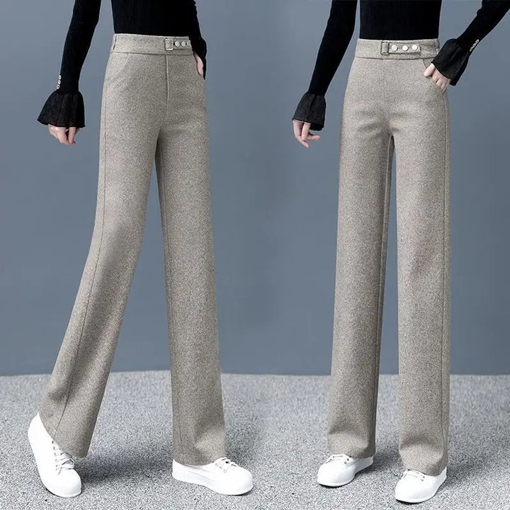 Sophisticated women's high-waist Astoria pants with a bold statement belt, enhancing formal and casual looks.