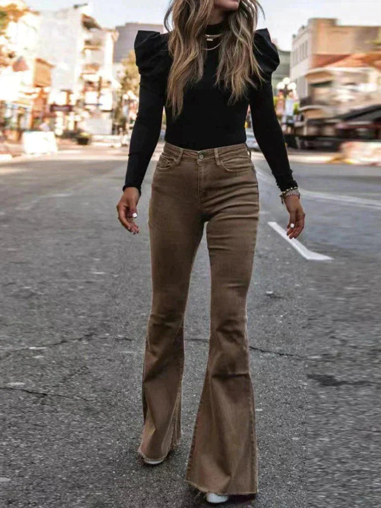 Versatile black high waist flare pants for women with pockets, easily dressed up or down for occasions.