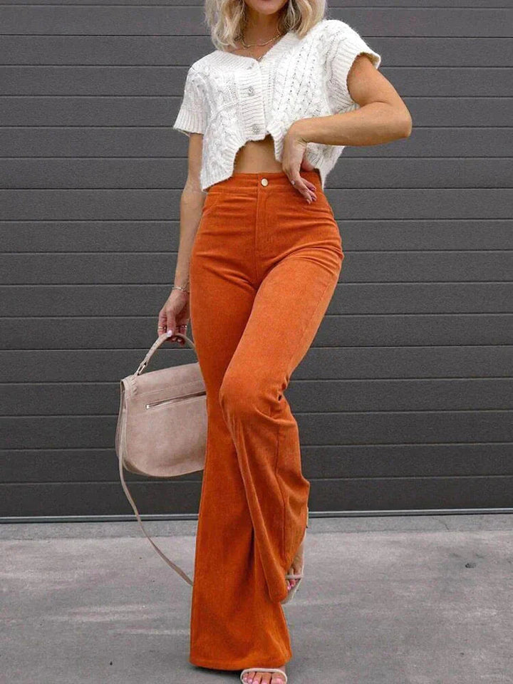 Casual women's high waist black flare pants with pockets, styled for a relaxed yet chic everyday look.