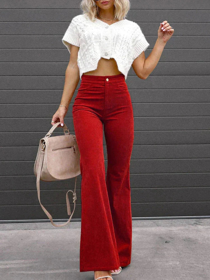Professional women's high waist flare pants, ideal workwear bottoms with pockets for a refined outfit.