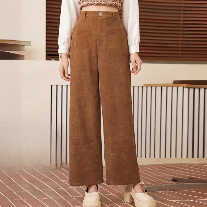 Women's high-waist brown trousers. Stylish and comfortable pants, perfect for versatile office or casual wear.