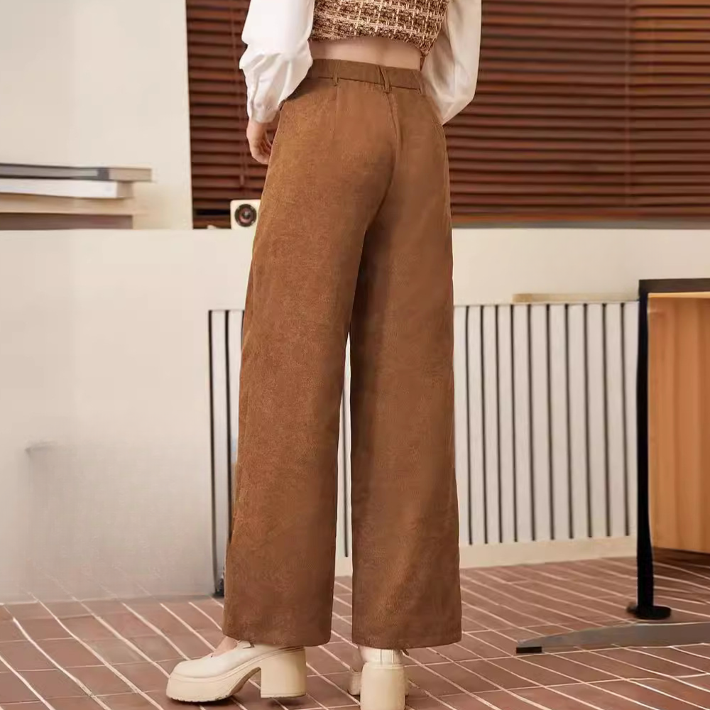 Stylish women's brown high-waist trousers, offering comfort & a flattering fit. Ideal for chic office or casual outfits.