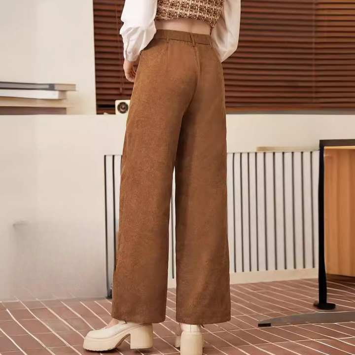 Stylish women's brown high-waist trousers, offering comfort & a flattering fit. Ideal for chic office or casual outfits.