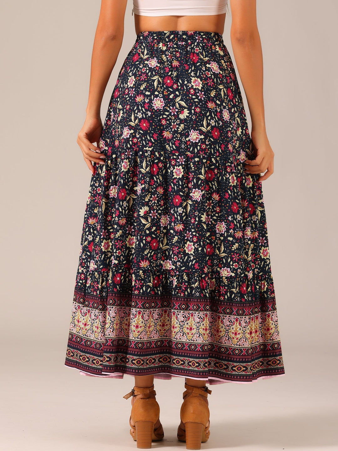 Bohemian high waist maxi skirt, vibrant print, with a dramatic flowing side slit.
