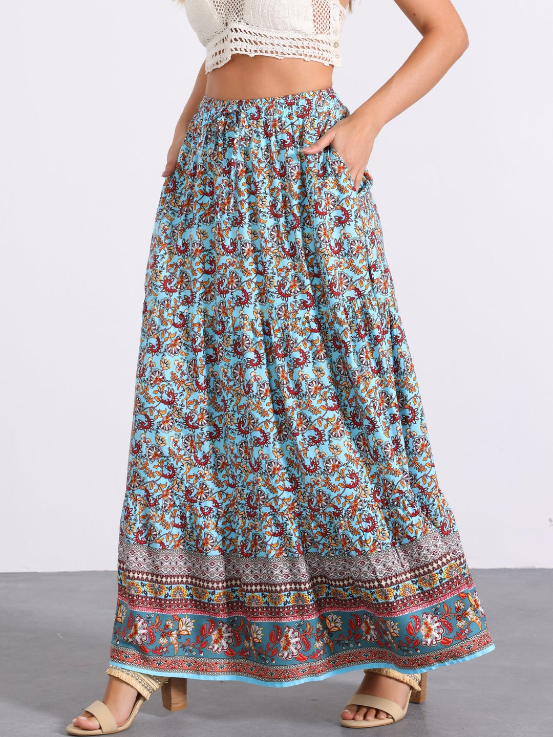 Women's flowing printed high waist maxi skirt, perfect for a bohemian summer look.