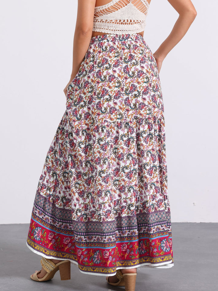 Bohemian flowing high waist maxi skirt, printed, with an eye-catching side slit.