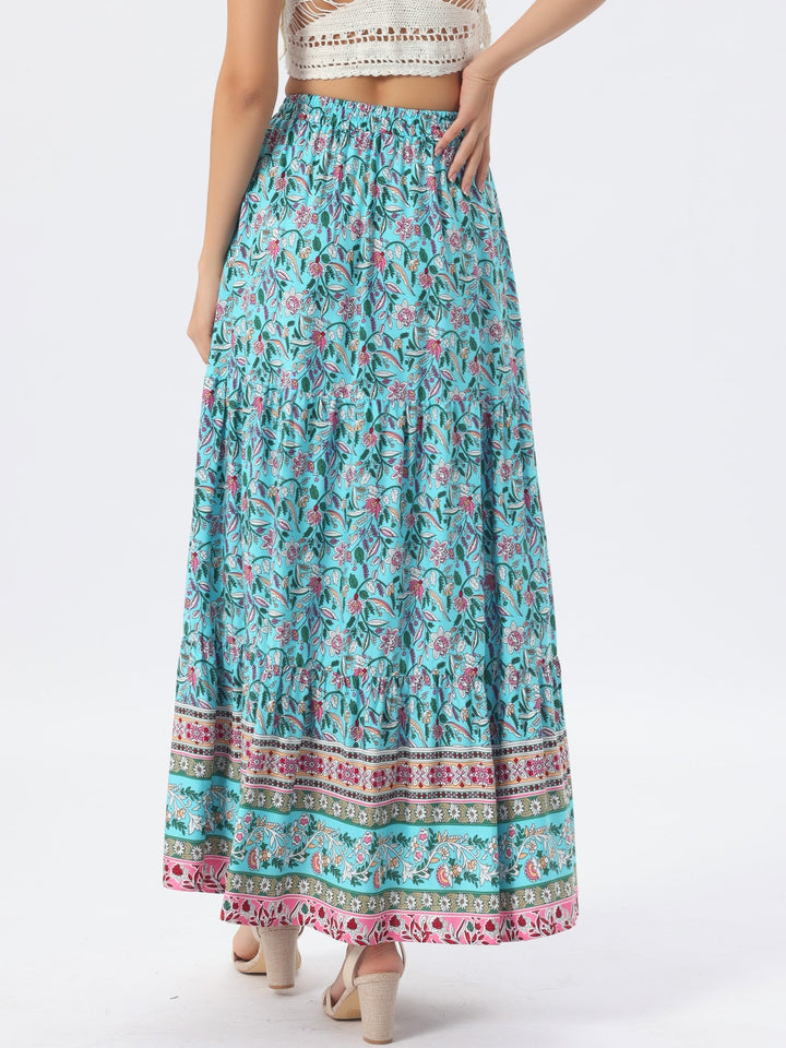 Printed high waist maxi skirt with a flowing side slit, ideal for bohemian casual wear.