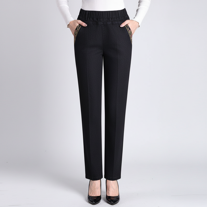Closeup of women's push-up straight leg jeans fabric, highlighting the stretch denim texture.
