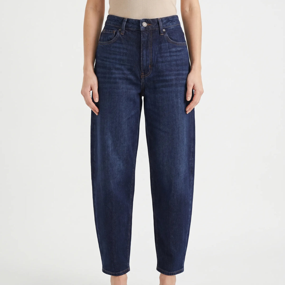 Stylish women's high-waist barrel-leg pants with a relaxed fit for modern casual wear and all-day comfort.