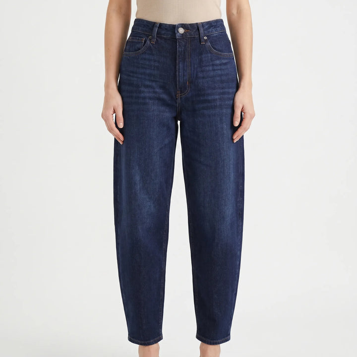 Stylish women's high-waist barrel-leg pants with a relaxed fit for modern casual wear and all-day comfort.