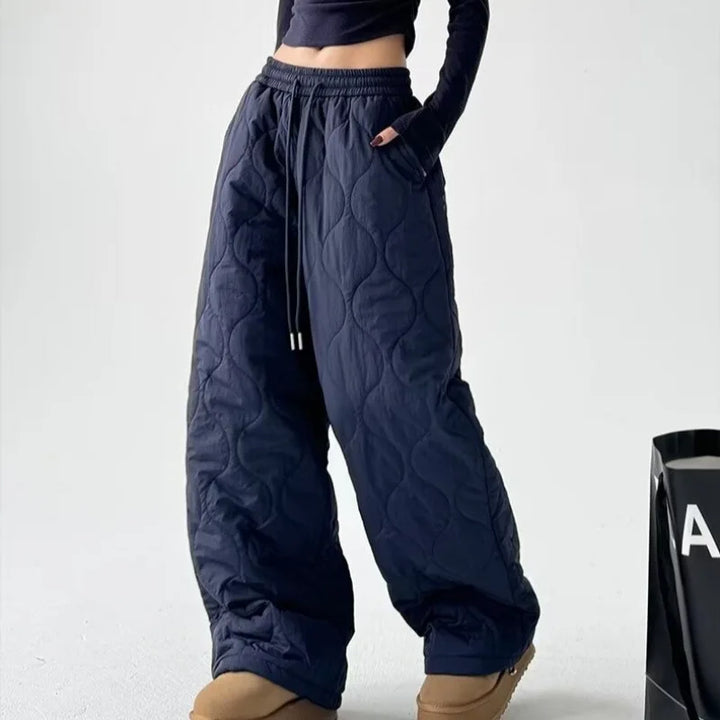 Cozy women's blue high-waist wide-leg pants, offering a relaxed fit & comfortable style for daily wear.