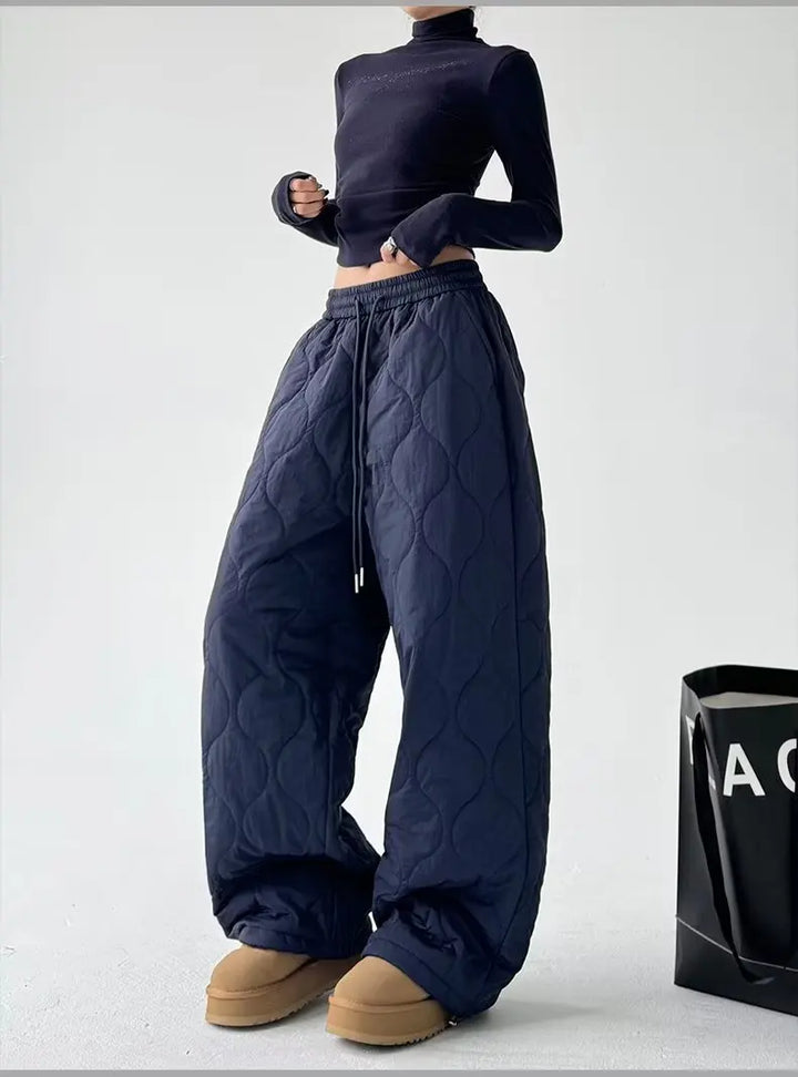 Women's stylish black high-waist wide-leg pants for comfortable, casual wear. Relaxed fit trousers.
