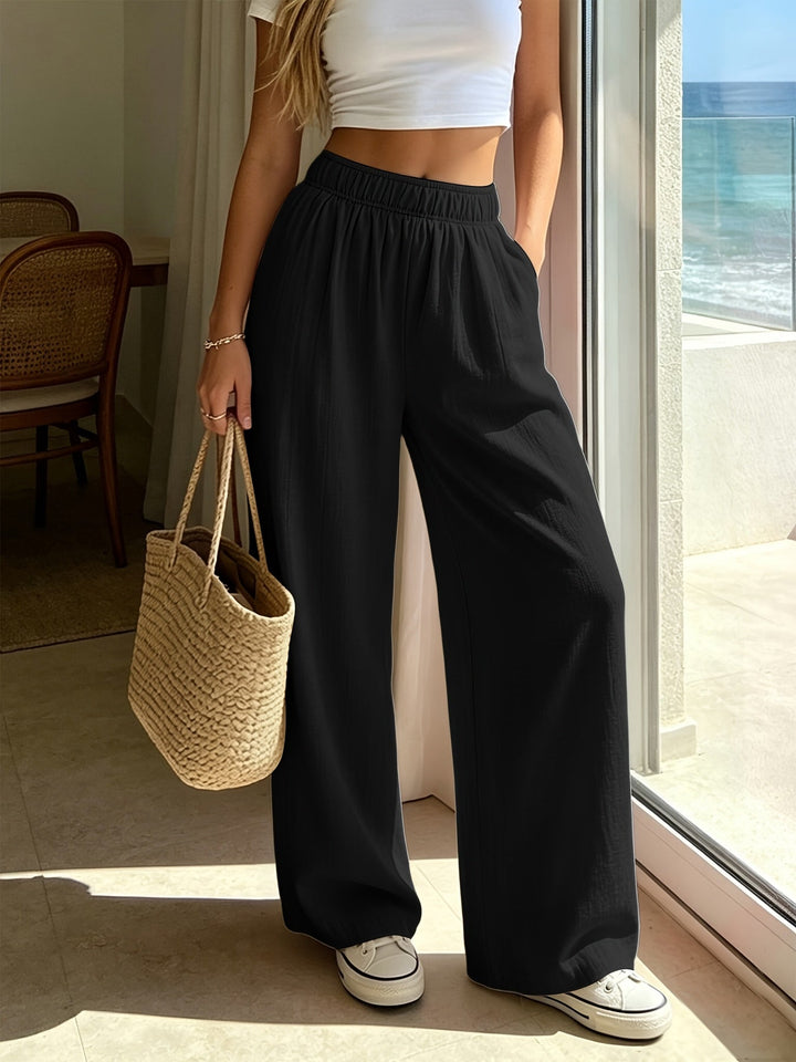 Comfortable women's flowing wide leg drawstring pants for relaxed vacation wear and beach outfits.