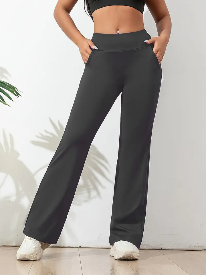 Versatile women's high-waisted flared yoga pants with stretch fit. Ideal for workouts, lounging, or casual wear.