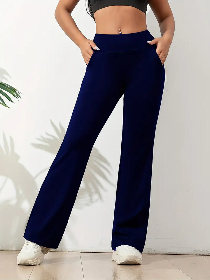 Comfortable women's high-waisted flared athletic pants in black. Stylish stretch fit activewear for women's fashion.