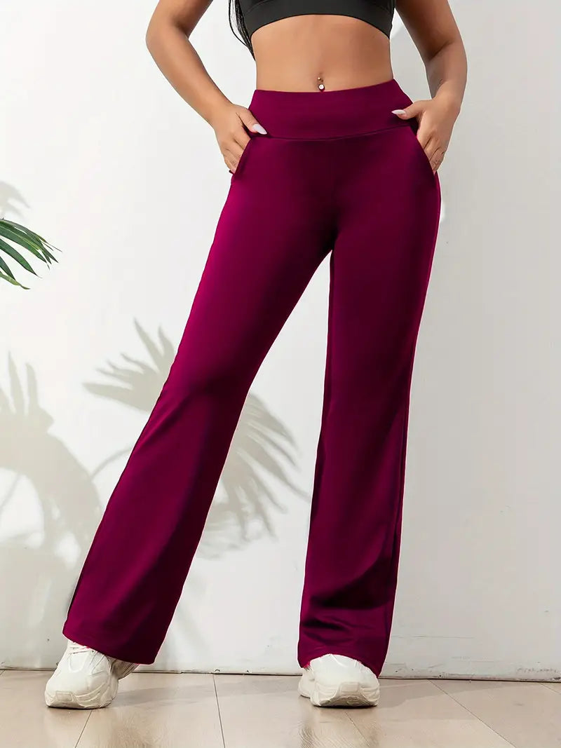 Black high-waisted flared sport pants for women. Stretch fit athletic activewear, great for workouts & daily comfort.