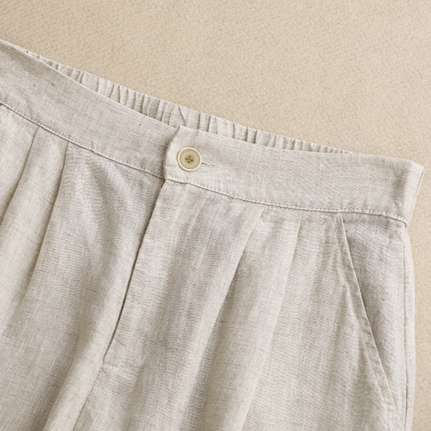 Versatile women's high-waisted shorts, pleated and flowy, suitable for casual everyday style or resort wear.
