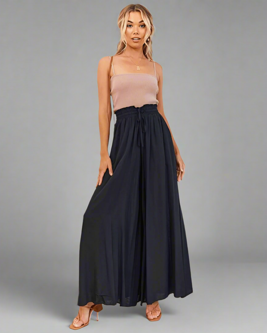 Mira lightweight high-waisted summer trousers with a drawstring, ideal for comfortable vacation outfits.