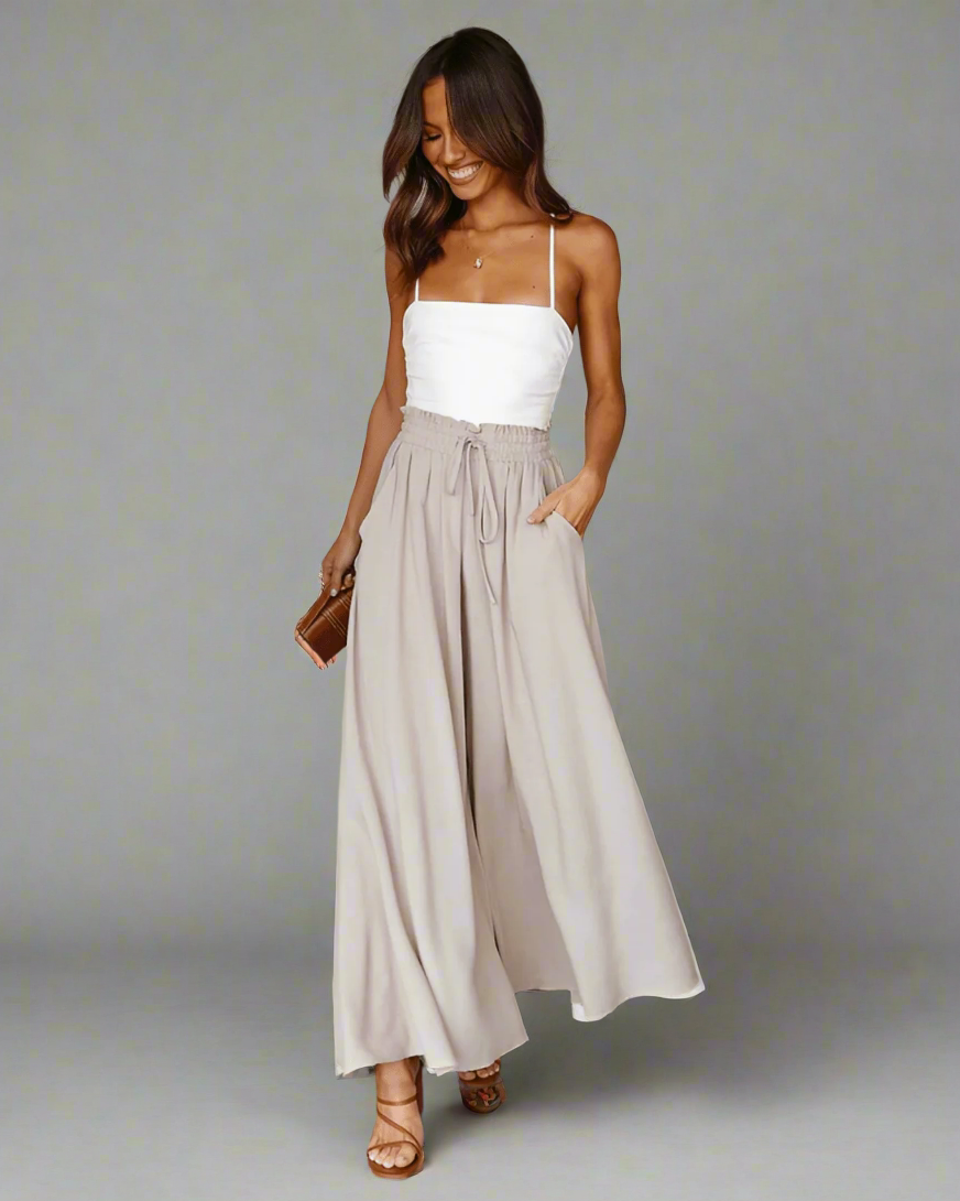 Model wearing women's high-waisted summer trousers, demonstrating their flattering fit and relaxed look.