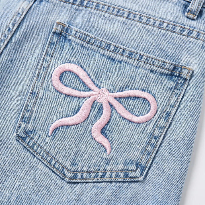 Relaxed fit women's high-waisted wide-leg jeans with charming cherry embroidery, ideal for fashion-forward looks.