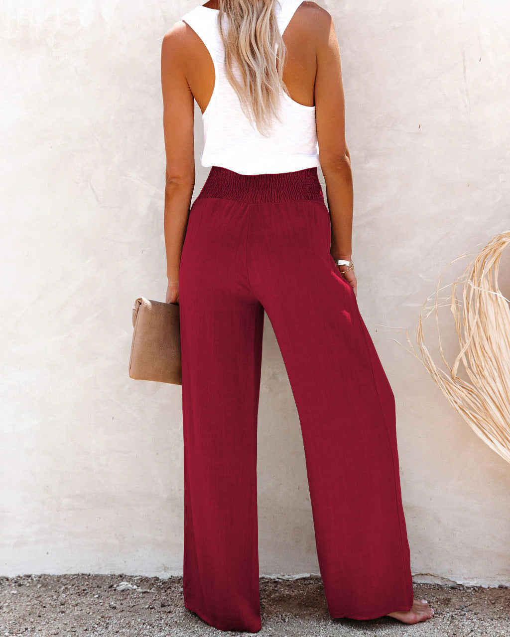 Women's casual high waisted wide leg linen trousers in a light color for warm weather