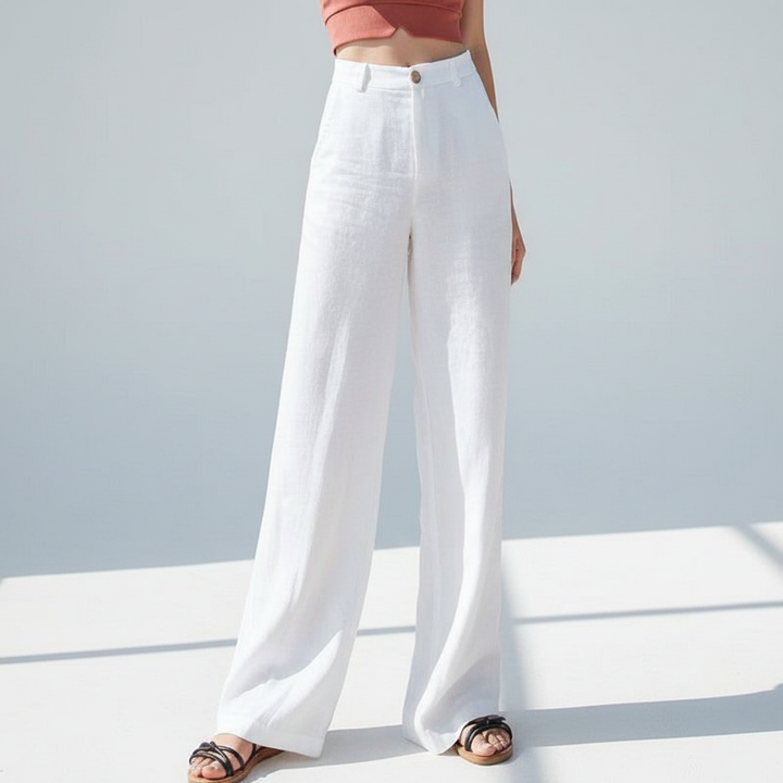 Full-length view of women's comfortable white linen wide-leg trousers, a versatile high-waist design.