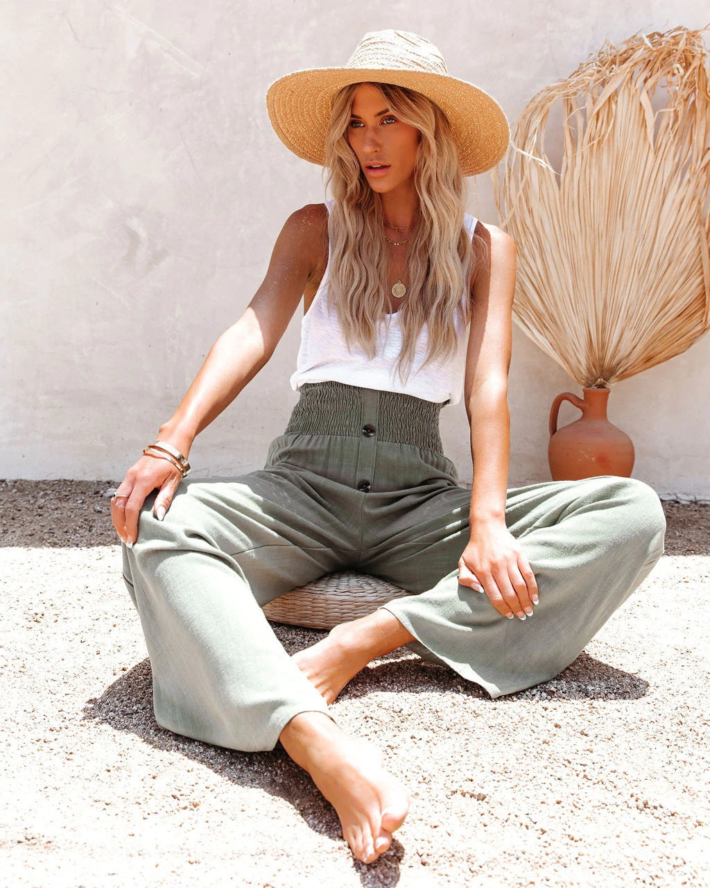 Fashionable women's high waisted wide leg linen trousers, styled for summer comfort