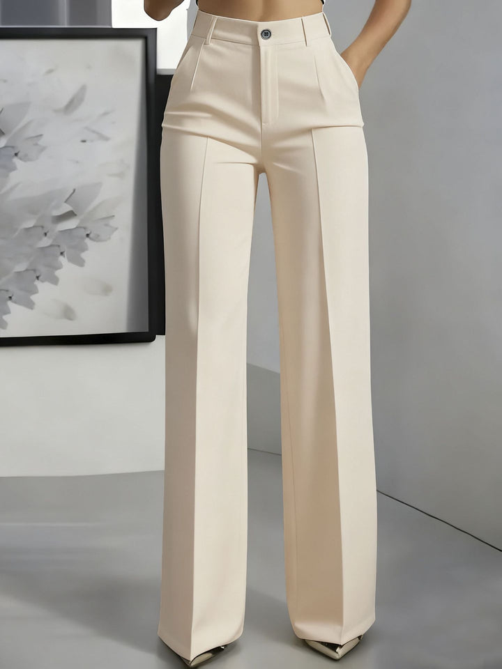 Modern women's wide-leg high-waist trousers. Structured fit offers a sleek silhouette for chic office or casual outfits.