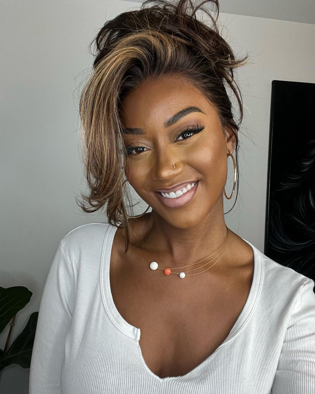 Get a natural look with this women's highlighted human hair lace front wig. Dark brown with blonde wavy streaks.