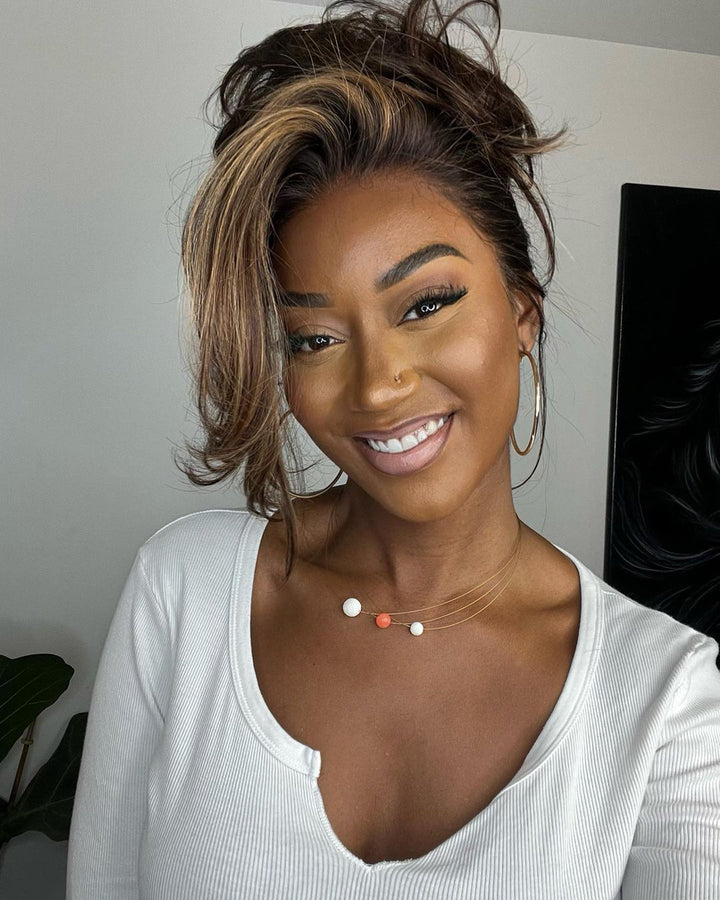 Get a natural look with this women's highlighted human hair lace front wig. Dark brown with blonde wavy streaks.